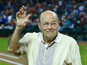 In this April 14, 2013, file photo, Arizona Diamondbacks broadcaster Joe Garagiola waves to a cheering crowd during festivities honouring the retiring broadcaster, prior to a game against the Los Angeles Dodgers, in Phoenix. (AP Photo/Ross D. Franklin, File)