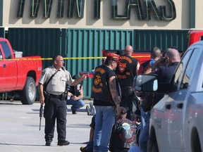 In this May 17, 2015 file photo, authorities investigate a shooting in the parking lot of the Twin Peaks restaurant in Waco, Texas. (AP Photo/Jerry Larson, File)
