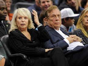 In this Nov. 12, 2010, file photo, Donald Sterling, right, watches the Los Angeles Clippers play the Detroit Pistons in Los Angeles. (AP Photo/Mark J. Terrill, File)