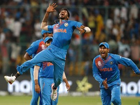 India’s Hardik Pandya jumps as Yuvraj Singh (right) celebrates India’s win over Bangladesh in the World Twenty20 match yesterday. (AP)