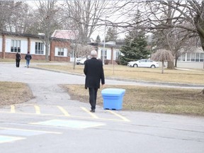 Jason Miller/The Intelligencer
Gareth Jones, of the Ontario Public Service Employee Union, walks to the entrance of Saganoska demonstration school in an attempt to attend a meeting between Education Minister Liz Sandals and parents, students and staff, but was not allowed to enter the talks.