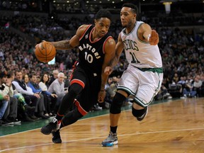 Toronto Raptors guard DeMar DeRozan dribbles the ball as Boston Celtics guard Evan Turner defends during first-half NBA action at TD Garden in Boston on March 23, 2016. (Bob DeChiara/USA TODAY Sports)