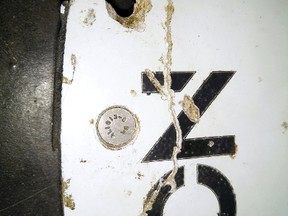A photograph of debris thought to be from the missing Malaysian Airlines MH370 plane is seen in this handout photo taken on February 28, 2016. Australia said on March 24, 2016 that plane debris recovered earlier this month from Mozambique was highly likely to have come from a Malaysia Airlines jet missing for more than two years. The Malaysian Investigation Team for missing Flight MH370 has found that both pieces of debris are consistent with panels from a Malaysia Airlines Boeing 777 aircraft, Australia's minister for infrastructure and transport Darren Chester said.  MANDATORY CREDIT REUTERS/Blaine Gibson/Australian Transport Safety Bureau