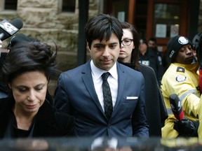 Jian Ghomeshi leaves Old City Hall court after a judge found him not guilty on all charges on Thursday March 24, 2016. (Craig Robertson/Toronto Sun)