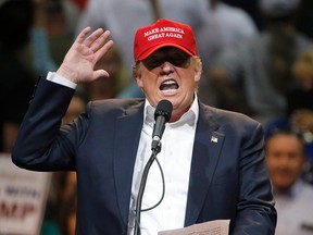 In this March 19, 2016, photo, Republican presidential candidate Donald Trump speaks during a campaign rally in Tucson, Ariz. The multimillion-dollar Republican effort to tear down the party’s presidential front-runner, Trump, is providing Democrats with a playbook for the general election. The Associated Press found that 68 different anti-Trump advertisements have shown some 40,000 times on broadcast television, and the paid-media assault has intensified in the past month.(AP Photo/Ross D. Franklin)