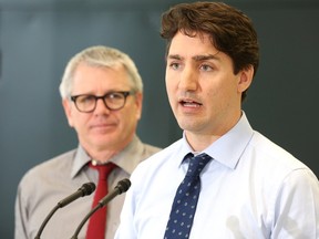 Prime Minister Justin Trudeau speaks during a visit to meet with some families to discuss Budget 2016 at the Trinity Community Recreation Centre in Toronto on Thursday, March 24, 2016. Liberal MP Adam Vaughan is at left. THE CANADIAN PRESS/Peter Power