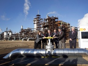 From left, Alberta Minister of Energy Marg McCuaig-Boyd, Shell Canada President Lorraine Mitchelmore, CEO of Royal Dutch Shell Ben van Beurden, Marathon Oil Executive Brian Maynard, Shell ER Manager Stephen Velthuizen, and British High Commissioner to Canada Howard Drake open the valve to the Quest carbon capture and storage facility in Fort Saskatchewan Alta, on Friday November 6, 2015. Quest is designed to capture and safely store more than one million tonnes of CO2 each year an equivalent to the emissions from about 250,000 cars. THE CANADIAN PRESS/Jason Franson