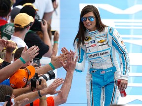 Danica Patrick greets fans as she is introduced before the Daytona 500 at Daytona International Speedway in Daytona Beach, Fla., Sunday, Feb. 21, 2016. (AP Photo/Wilfredo Lee)
