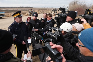 RCMP Sgt. Bert Paquet talks to media to update the public as searchers look through farmers' field and ditches hoping to find 2 year old Chase Martens near Austin, Man., on Thursday, March 24, 2016. THE CANADIAN PRESS/John Woods