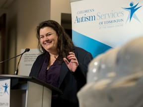 Executive director for Children's Autism Services of Edmonton Terri Duncan unveils the proposed south side site for children with autism in Edmonton, Alta on Thursday, March 24, 2016. The centre is scheduled to be completed in September 2016. (Photo by Ryan Wellicome)