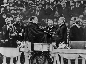 In this March 4, 1913, file photo, Woodrow Wilson takes the oath of office for his first term of the presidency in Washington. (The Associated Press)