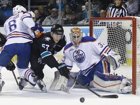 Oilers goalie Cam Talbot turns away the Sharks during first-period action Thursday in San Jose. (USA TODAY SPORTS)