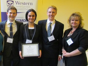 Winners of this year's Capstone design project competition were named at the Western Sarnia-Lambton Research Park Thursday March 24, 2016 in Sarnia, Ont. Students in their final year of Western University's chemical and biochemical engineering program prepared projects and competed for prize money provided by industry sponsors. From left, Julianne Pohlner of Worley Parsons, and members of one of the winning teams, Mark Pipher, Erica Glatt, and Clifford Palmer, with Janice McMichael Dennis of Bluewater Power.
 Paul Morden/Sarnia Observer/Postmedia Network