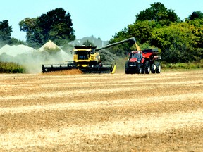 Chatham-Kent area farmers were harvesting soybean and corn crops earlier than usual in 2012 thanks to an early planting season. This file photo of soybeans being harvested near Charing Cross, Ont. was on Sept. 27, 2012. File Photo/Postmedia Network