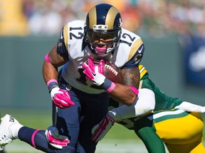 Rams wide receiver Stedman Bailey runs with the ball as Packers safety Micah Hyde defends during NFL action in Green Bay, Wis., on Oct. 11, 2015. Bailey was being shot in a car near his Miami-area hometown on Nov. 24. (Jeff Hanisch/USA TODAY Sports/Files)