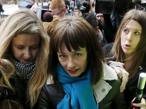 Actress Lucy DeCoutere, a complainant in the case against former Canadian radio host Jian Ghomeshi, leaves the court after an Ontario judge found him not guilty on four sexual assault charges and one count of choking, in Toronto, March 24, 2016. REUTERS/Mark Blinch
