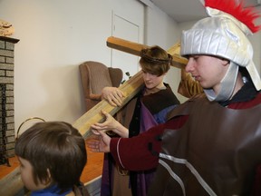 Jason Miller/The Intelligencer
Charlie Archer, plays Jesus and Matthew Ackey (right) takes on the role of a Roman soldier during a crucifixion demonstration held at Christ Church on Good Friday.