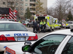 Paramedics load a patient into an ambulance after a woman drowned in the indoor swimming pool at 744 Proudfoot Lane in London. Building staff confirmed the woman was a tenant and was alone when discovered in the pool. (DEREK RUTTAN, The London Free Press)