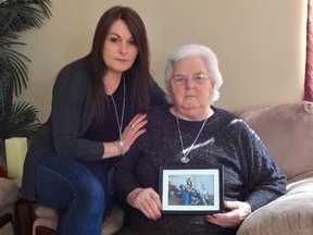 Cookstown resident Ruth Hannah, 85, holds a photo of her brother, Gerald Profitt, 71, who died before she could get to his hospital bedside in PEI. Her granddaughter, Joanne hannah, 46, is also pictured.  (SUPPLIED PHOTO)