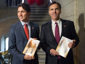 Prime Minister Justin Trudeau, left, poses with Minister of Finance Bill Morneau as he arrives to table the budget on Parliament Hill, Tuesday, March 22, 2016 in Ottawa. THE CANADIAN PRESS/Justin Tang