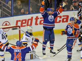 Edmonton Oilers forwards Patrick Maroon and Jordan Eberle celebrate a goal against the St. Louis Blues during a recent game at Rexall Place.  (Walter Tychnowicz/USA TODAY Sports)