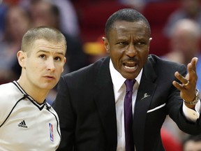 Raptors coach Dwane Casey talks with a referee during Friday's game in Houston. (AP)