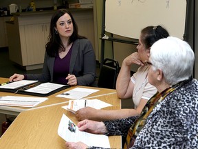 Oshawa NDP MPP Jennifer French, left, met with Kingston seniors including Hansa Daya and Delores Lanteigne at the Kingston Community Health Centres to discuss the rising costs of prescription drugs after the latest Ontario budget. (Ian MacAlpine/The Whig-Standard)