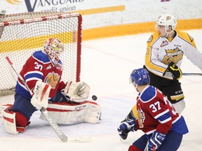 Edmonton Oil Kings goalie Payton Lee gets in front of a shot on the way to a 2-1 win over the Brandon Wheat Kings for a two-game advantage in their opening round of the WHL playoffs. The series switches to Edmonton for the next three games, if necessary. (Bruce Bumstead/Brandon Sun)