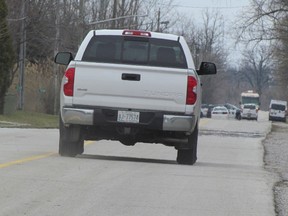 Police vehicles are shown on a closed section of Tashmoo Avenue, from Christopher Drive to LaSalle Line, on Saturday March 26, 2016 on the Aamjiwnaang First Nation at Sarnia. Sarnia Police said the discovery of the body of Jonathan Patrick Pike, 26, of Sarnia in a wooden area west of Tashmoo Avenue was being treated as a homicide.
(Sarnia Observer file photo)