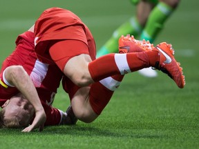 It was that kind of night for Canada, as Scott Arfield lands on his head after tripping over Mexico goalkeeper Alfredo Talavera during Friday’s 3-0 loss in their World Cup qualifying match in Vancouver. (THE CANADIAN PRESS/PHOTO)