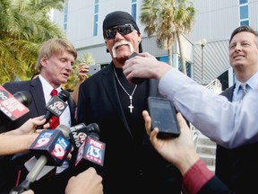 Hulk Hogan, whose given name is Terry Bollea, speaks to the media after a jury returned its decision on March 21 in St. Petersburg, Fla. A jury has hit Gawker Media with $15 million in punitive damages and its owner with $10 million, adding to the $115 million it awarded last week for publishing a sex video of Hogan. (Dirk Shadd/The Tampa Bay Times via AP)