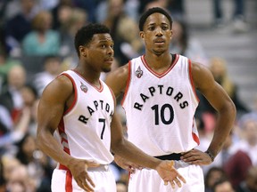 Toronto Raptors stars Kyle Lowry and DeMar DeRozan take a break against the Portland Trail Blazers in Toronto Friday March 4, 2016. (Craig Robertson/Toronto Sun)