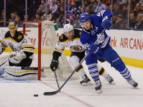 Toronto Maple Leafs forward Tyler Bozak tries to get away from the Boston Bruins’ Joe Morrow at the ACC in Toronto on Saturday, March 26, 2016. (Dave Thomas/Toronto Sun/Postmedia Network)