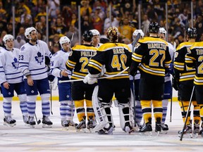 Members of the Boston Bruins and the Toronto Maple Leafs shake hands following the Bruins' overtime win in Game 7 of their Eastern Conference quarterfinal series on May 13, 2013 at TD Garden in Boston, Mass.
(JARED WICKERHAM/Getty Images/AFP files)