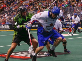 Rock's Stephan Leblanc works his way past Kyle Rubisch of the Rush during Friday's NLL action at the ACC. Saskatchewan scored a 13-8 victory on Saturday in Saskatoon to sweep the home-and-home set. (DAVE THOMAS/TORONTO SUN)