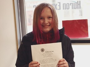 Marissa Price,11, from Seaforth holds the poem she wrote. (Shaun Gregory/Huron Expositor)