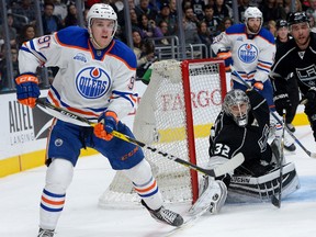 Los Angeles Kings goalie Jonathan Quick (32) and Los Angeles Kings defenceman Alec Martinez (27) defend the goal as Edmonton Oilers centre Connor McDavid (97) waits for a pass in the third period of the game at Staples Center. (Jayne Kamin-Oncea-USA TODAY Sports)