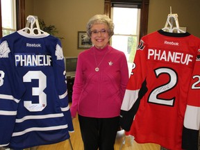 Volunteer Wilma McNeill displays a pair of autographed Dion Phaneuf jerseys set to be raffled off in support of St. Joseph's Hospice. McNeill, who is Phaneuf's great-aunt, has been organizing the annual jersey raffle for the last six years. Close to $20,000 has been raised for the hospice over the last five years.  Barbara Simpson/Sarnia Observer/Postmedia Network