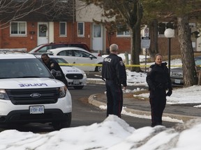 Police investigate the scene of a shooting near Old Richmond Road and Seyton Drive on Sunday, March 27, 2016.  (Patrick Doyle, Postmedia Network)