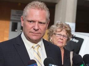 Doug Ford is pictured several months ago while updating the media about his brother's condition at the time. His mother, Diane Ford, is pictured in the background. (CRAIG ROBERTSON, Toronto Sun)