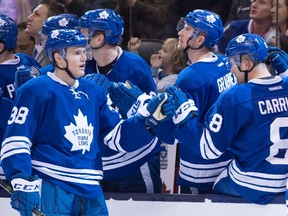 Toronto Maple Leafs' Colin Greening is congratulated by teammates after his goal against the Boston Bruins during first period NHL action in Toronto on Saturday, March 26, 2016. (THE CANADIAN PRESS/Frank Gunn)