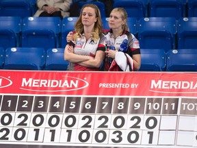 Canada skip Chelsea Carey, left, is consoled by teammate Laine Peters after losing to Russia in the bronze medal game at the women's world curling championship in Swift Current, Sask. Sunday, March 27, 2016. (THE CANADIAN PRESS/Jonathan Hayward)