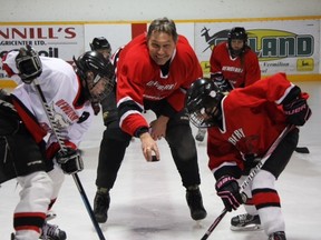 Above, Vermilion-Lloydminster MLA Richard Starke drops the puck during the minor hockey portion of the last game ever played in the Dewberry Arena