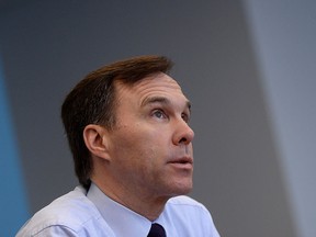 Finance Minister Bill Morneau takes part in an interview at Finance Headquaters in Ottawa on Thursday, March 24, 2016. THE CANADIAN PRESS/Sean Kilpatrick