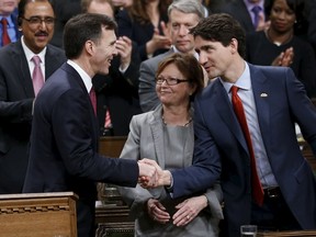 Prime Minister Justin Trudeau (R) shakes hands with Finance Minister Bill Morneau after delivering the federal budget in the House of Commons on Parliament Hill in Ottawa on March 22, 2016. (Toronto Sun files)