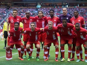 Canadian players pose for a team photo prior to playing Mexico during a FIFA World Cup qualifying soccer match in Vancouver, B.C., on Friday March 25, 2016. (Darryl Dyck/Canadian Press)