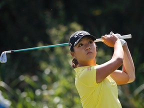 Lydia Ko, from New Zealand, watches her tee shot on the par three third hole during the final round of the Kia Classic women's golf tournament Sunday, March 27, 2016, in Carlsbad, Calif. (AP Photo/Lenny Ignelzi)