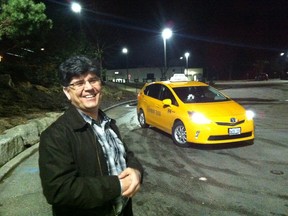 Nema Abbasey, a driver with Yellow London Taxi, says Uber?s arrival has cut his earnings by 25 per cent. (NORMAN DEBONO, The London Free Press)