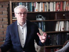 NDP leader Greg Selinger uses the setting of a St. James home to announce if re-elected he would reduce parking rates at hospitals and cut ambulance fees in half. (TOM BRODBECK/WINNIPEG SUN/POSTMEDIA NETWORK)