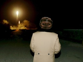 North Korean leader Kim Jong Un watches the ballistic rocket launch drill of the Strategic Force of the Korean People's Army (KPA) at an unknown location, in this undated photo released by North Korea's Korean Central News Agency (KCNA) in Pyongyang on March 11, 2016. (REUTERS/KCNA)